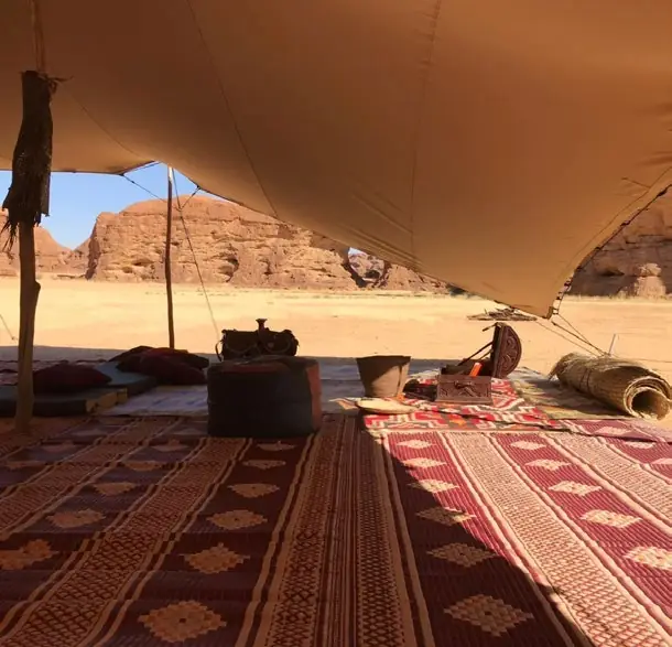 Warda Camp lounge beneath the desert cliffs