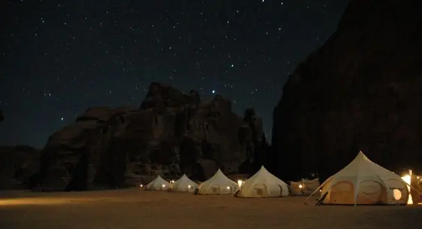 Warda Camp tents beneath the sandstone cliffs
